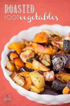 roasted root vegetables in a white bowl on a red tablecloth with text overlay