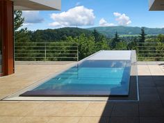 an empty swimming pool on top of a building