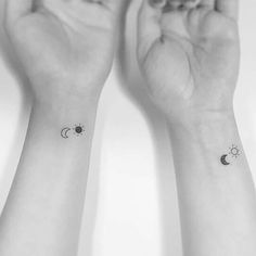 two wrist tattoos with sun and moon on each one hand, both showing the same symbol