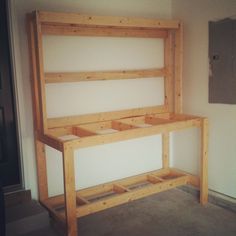 a wooden bed frame sitting in the middle of a room with no mattresses on it