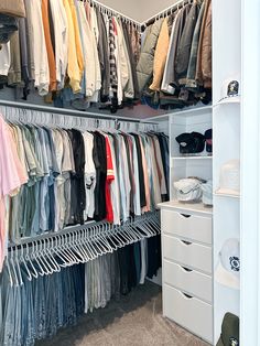 an organized closet with clothes and shoes