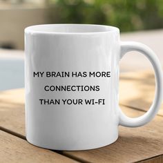 a white coffee mug that says, my brain has more connections than your wi - fi