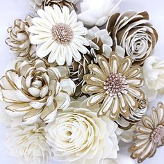 white and gold flowers on a white surface