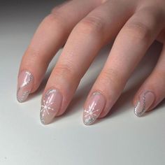 16. Silver Swirls and Snowflakes for Winter Magic Natural Christmas Nails, Neutral Christmas Nails, Subtle Christmas Nails, Snowflake Christmas Nails, Short Christmas Nails, Festive Manicure, Glitter French Tips, Neutral Christmas, Classic French Manicure