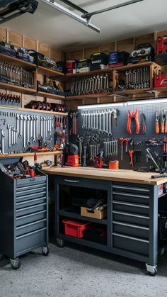 a garage filled with lots of tools and workbench storage units on top of each other