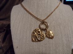 This gold necklace has two metal  heart charms and measures 18 inches long. Heart Charm Necklace, Metal Heart, Antique Stores, May 5, Gold Heart, Heart Of Gold, Heart Charm, Charm Necklace, Vintage Designs