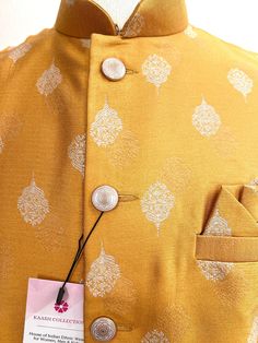 Mango Yellow Color Mens Jacket with Sliver/white embossed leaf design. Can be paired with a Kurta Pajama Set. Item : Men's JacketReady to Wear : YesJacket Color : Mango Yellow Fabric : SilkWork : Fancy buttons, Self Deign Pattern Material Pattern : DesignerLining : Yes Measurements of the Jacket Size - 38Chest : 40 inches Length : 27 inches Size - 40Chest : 42 inches Length : 27 inches Size - 42Chest : 44 inches Length : 28 inches Size - 44 Chest : 45 inches Length : 28 1/2 inches Disclaimer-For Wedding Wear For Men, Nehru Jacket For Men, Mango Yellow, Men's Ethnic Wear, Waist Coat, Fancy Buttons, Nehru Jacket, Indian Wedding Wear, Bandhani Saree