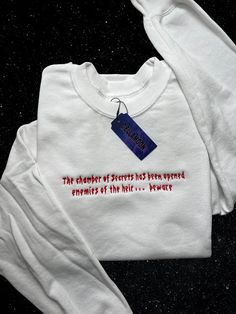 Chamber Of Secrets Inspired Embroidered Crewneck in white with a shiny satin stitching. Adult Unisex Sizes S-5XL Washing instructions: -Machine wash cold  -Dryer low heat  -Don't iron or bleach Mystery Story, Comfy Sweatshirts, Colourful Fashion, Chamber Of Secrets, Bleach T Shirts, Embroidery Sweater, Unique Sweaters, Book Clothes, Embroidery Sweatshirt