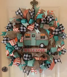 a welcome wreath with a camper on it