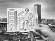 a person holding up a drawing on top of a building