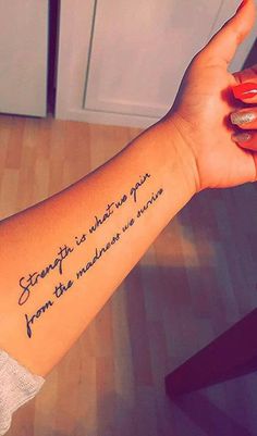 a woman's arm with a quote tattooed on the wrist that says, strength is where you from the middle distance