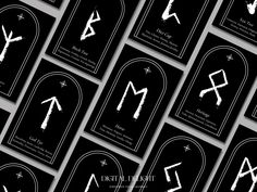 the business cards are all black and white with some symbols on them, as well as arrows