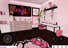 a hello kitty themed bedroom with pink accents