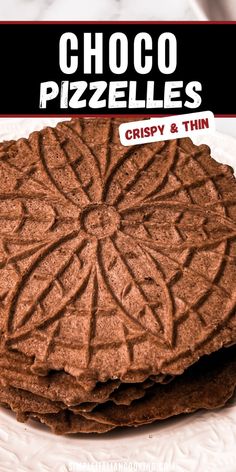 chocolate pizzas crispy and thin on a white plate with the words choco pizzellas