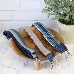 A strap gives your bag, tote or purse flair and functionality! Try using unique woven webbing or strapping to give your creation extra personality. Our Make-a-Strap pattern is a collection of four strap styles so you can choose the look you prefer or for the hardware you have on hand. FINISHED SIZE: 1" wide, 1-1/2" wide, or 2" wide. PATTERN DIFFICULTY: 2 Beginner FEATURES: An easy to sew strap using woven webbing and cork or faux leather accent HARDWARE REQUIRED: (2) 1/2" Swivel Hooks - STS160x Modern Adjustable Bag Strap, Adjustable Modern Bag Strap For Everyday, Adjustable Bag Strap With Leather Handles For Travel, Adjustable Bag Strap With Leather Handles For Daily Use, Adjustable Blue Bag Strap For Everyday Use, Adjustable Casual Bag Strap For Everyday Use, Casual Adjustable Bag Strap For Everyday Use, Adjustable Rectangular Modern Bag Strap, Modern Adjustable Rectangular Bag Strap