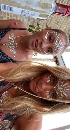 two women with face paint and body art on their faces, one woman has long blonde hair