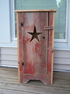 an old wooden door with a star painted on it