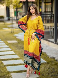 <ul>
<li style="text-align: justify;"><span data-preserver-spaces="true"> Try out some ethnic touch kaftan kurti made with gaji silk and digitally printed in bandhani and patola border with gajji silk golden patta also embellished with gotta patti lace and waist drawcord with tessel.</span></li>
<li style="text-align: justify;"><span data-preserver-spaces="true">This feautured yellow kaftaan is ready to wear free size " (Customer can adjust up to 44 Kaftan Dress Modern, Patola Border, New Lehenga Designs, Kaftan Kurti, Kaftan Style Dresses, Bandhani Dress, Kaftan Designs, Lehenga Blouse Designs, Gotta Patti