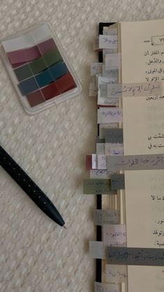 several pieces of paper with writing on them next to a pen and ink rollers