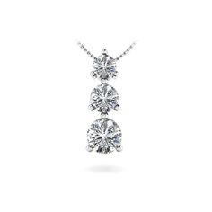 Proudly made in the USA, this diamond pendant is set in white gold and features three graduated round cut diamonds (0.04ct, 0.08ct and 0.15ct) in a three prong setting. Suspended by a white gold cable-link chain with your choice of length. Approximately 1/3 carat total weight. Luxury Three Stone Diamond Necklace, Three Stone Diamond, Heart Diamond, Heart Pendant Diamond, 3 Carat, Three Stone, Round Cut Diamond, Diamond Pendant, Link Chain