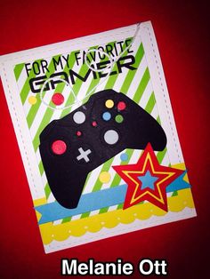 a close up of a card with a video game controller on it's side