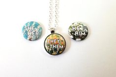 This unique pronoun necklace has a magnet insert that allows you to change the design or the pronoun on your jewelry. The inspired by the meadows of wildflowers I remember from my childhood. The circle pendant is 1" in diameter and can hold any of my 1" button designs (available separately). This necklace includes the three designs shown in your choice of pronouns and an 18 inch rolo chain (shown) or rope cord. Pronoun Necklace, Magnetic Jewelry, Rope Cord, Necklace Flower, The Meadows, My Childhood, The Circle, Rolo Chain, Button Design