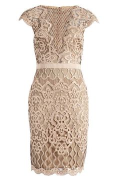 An elegant frock exquisitely fashioned from ornate lace sparkling in tonal sequins is perfect for weddings, cocktail parties and date nights. 39 1/2" length (size 8) Hidden back-zip closure Bateau neck Cap sleeves Partially lined 60% polyester, 40% nylon Dry clean Imported Sleeveless Embellished Evening Lace Dress, Luxury Lace Trim Dress For Gala, Sleeveless Lace Patchwork Dress For Gala, Elegant Scalloped Lace Mother Of The Bride Dress, Glamorous Lace Dress With Fitted Bodice For Gala, Glamorous Lace Dress With Sequins, Glamorous Embellished Lace Party Dress, Elegant Fitted Evening Dress With Lace Work, Luxury Lace Gala Dress