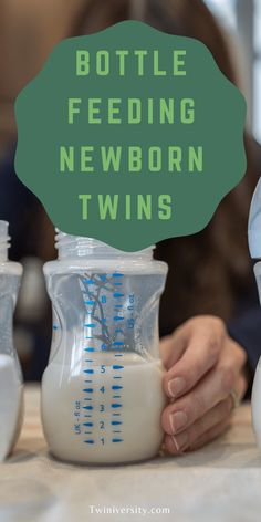 someone is pouring milk into a bottle with the words bottle feeding newborn twins on it