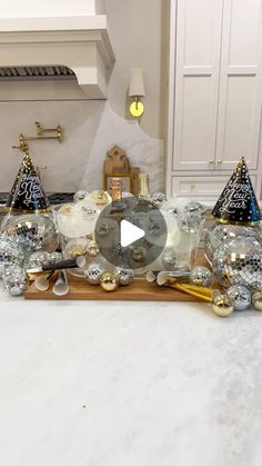 a kitchen counter topped with lots of christmas decorations