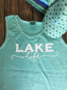 Lets start the weekend now, Lake weekends can not come soon enough this year. Get ready with our new tank top. Whether you are at the lake or just in that lake life state of mind you will be comfortable in this great loose style unisex tank top. The tank is a little oversized so it also works great as a bathing suit cover up. THIS LISTING IS FOR ONE TANK TOP. If you are putting an order together for a group please let me know. We offer group discounts and combined shipping options. As with all o Casual Letter Print Vest For Spring, Sleeveless Vest For Summer Outdoor Activities, Cotton Tops For Outdoor Beach Season, Green Sleeveless Tank Top With Letter Print, Green Letter Print Sleeveless Tank Top, Green Sleeveless Letter Print Tank Top, Casual Sleeveless Tank Top For Outdoor Activities, Summer Sleeveless Tank Top For Outdoor Activities, Sleeveless Tank Top For Outdoor Summer Activities