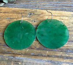 These large round disc earrings are crafted in genuine Canadian nephrite jade stud. Each piece of jade measures 30mm around (1.18 inches) The hooks are 925 sterling silver. 30 day satisfaction guarantee! Jade is a natural stone, so the shade of color may vary slightly. All of our jade is grade A, unless otherwise noted. It is 100% Pure Nephrite Jade, with no treatments whatsoever. What is Jade? Jade is one of two gemstones, nephrite jade or jadeite jade. Nephrite jade , (a silicate of calcium an Nephrite Jade, Disc Earrings, Natural Stone, Natural Stones, Jade, 925 Sterling Silver, Pure Products, Gemstones, Sterling Silver