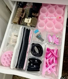 the drawer is filled with various crafting supplies