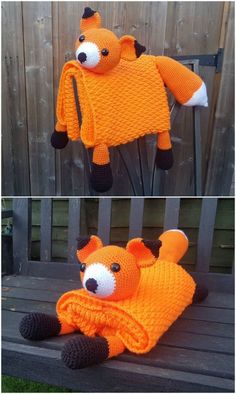 an orange knitted animal laying on top of a wooden bench