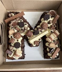 a box that has some kind of cake in it with chocolate and marshmallows on top