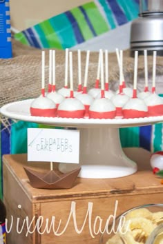 an assortment of desserts displayed on a cake plate at a birthday party or celebration