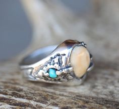 Introducing our new line of Elk Tooth (elk ivory) "Lost Wax Casting" rings! This custom, hand-carved design features elk tooth and inset turquoise, but could be crafted with almost any design you can think of! Additional wood and inlay options available upon request. Each ring is hand-carved by our in-house artist Kevin Fredrickson, and set using an ethically collected elk tooth. Available in: SILVER We love taking on custom orders. If you have your own idea for a design reach out to us in the contact section of the website, we want to make something as unique and special as the love you have found. Wax Casting Rings, Lost Wax Casting Rings, Elk Ivory Jewelry, Elk Ivory, Ivory Jewelry, Antler Wedding Band, Hand Carved Ring, Tooth Ring, Turquoise Ring Engagement