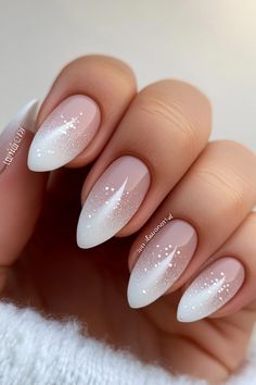 These delicate frosted nails with white details bring the perfect winter wonderland vibe! Whether you're keeping it casual or dressing up, this winter nail design adds just the right amount of charm. Visit nailhow.com for more winter nail colors and ideas and save this pin for your next manicure! Oval Pink And White Nails, Almond Nails Christmas Designs Simple, Gel Nails Winter Colors, Winter Nails Round Shape, Winter Nails Round, Nails Winter White, White Winter Nail Designs, Christmas Nail Ideas Winter, White Nails Inspiration