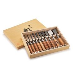 a wooden box filled with lots of different types of utensils