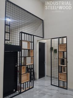 an industrial steel and wood room divider is shown in the middle of a hallway