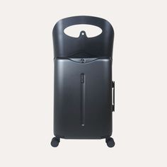 a black piece of luggage on wheels with a handle that is attached to the side