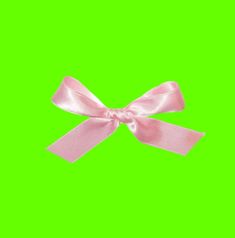 a pink bow on a green screen