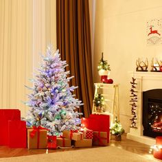 a decorated christmas tree with presents in front of it