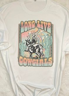 Retro western Long Live Cowgirls graphic tee, -This is Sublimation design direct to garment print onto white color tee. -Tee is pre-shrunk men size fitting made from 50% cotton and 50% polyester! -Size chart is listed in images! **Shirt is made to order, and processing times is estimated 1-3 business days! *Due to nature of Handmade goods this order is not allowed for returns or exchanges, but if you have any concerns, please do contact me and I would be happy to help you! *Care instructions: -M Retro Summer Rodeo T-shirt, Western Style Relaxed Fit T-shirt With Screen Print, Western Style Crew Neck T-shirt With Graphic Print, Graphic Print Crew Neck T-shirt For Rodeo, Retro Rodeo T-shirt With Screen Print, Retro Western, Western Graphic Tees, Not Allowed, Long Live