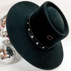 Charlie 1 Horse is wowing us with their amazing fall and winter collection! Grab one of these quick before they're gone! The Cosmic Cowgirl hat by Charlie 1 Horse features wool felt material, an open face profile, a 4 1/4 inch brim, and a full circle crown. The hatband is genuine black leather with white star detailing. This genuine Charlie 1 Horse hats bears the brand "C," a sign that you are getting a quality made authentic Charlie 1 Horse hat. Please note that all hats are branded by hand by Full Circle Crown, Cosmic Cowgirl, Charlie 1 Horse Hat, Trendy Boutique Clothing, Face Profile, Giddy Up Glamour, Cowgirl Hat, Trendy Boutique, Open Face