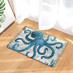 an octopus rug sitting on the floor next to a window