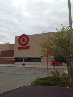 a target store with a basketball hoop in front of it and trees outside the building