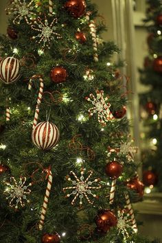 a decorated christmas tree with red and white ornaments