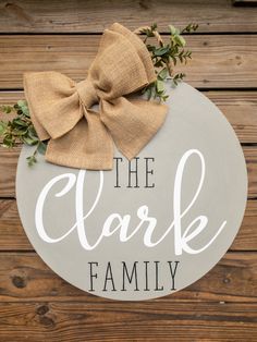 the clarke family sign with a bow on it