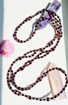 "Vitality Garnet Tantric Necklace" – Elevate Your Energy and Spiritual Practice Step into a realm of heightened vitality and spiritual empowerment with our "Vitality Garnet Tantric Necklace," a divine fusion of elegance and potency. Each necklace is meticulously crafted with 416 gemstones intricately joined in a pattern representing the sacred 8 Fold Path of Yoga, making it a profound yogic tool to enhance your magnetic field and elevate your spiritual journey. Key Features: 📿 Intricate Design: 8 Fold Path, Rituals Set, Mala Meditation, Oil Shop, Magnetic Field, 108 Bead, Demi Fine Jewelry, Mala Necklace, Spiritual Jewelry