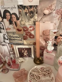 a table topped with lots of different types of perfumes and other items on top of it